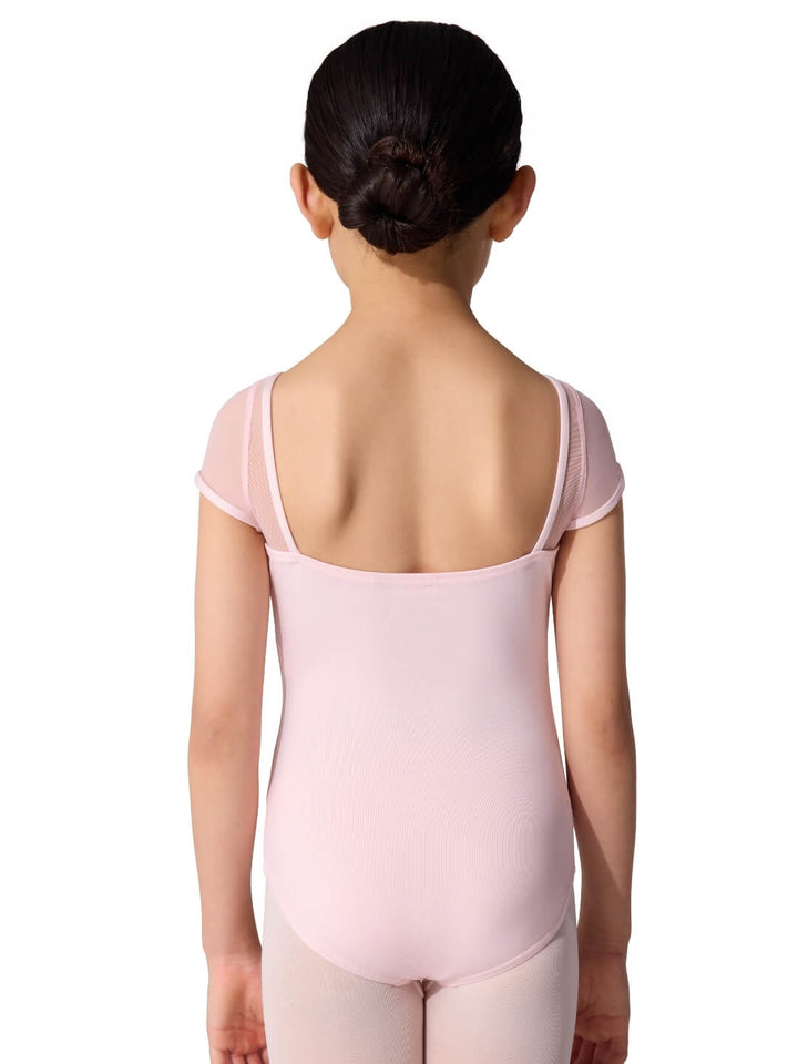 Person wearing a pink ballet leotard on a white background