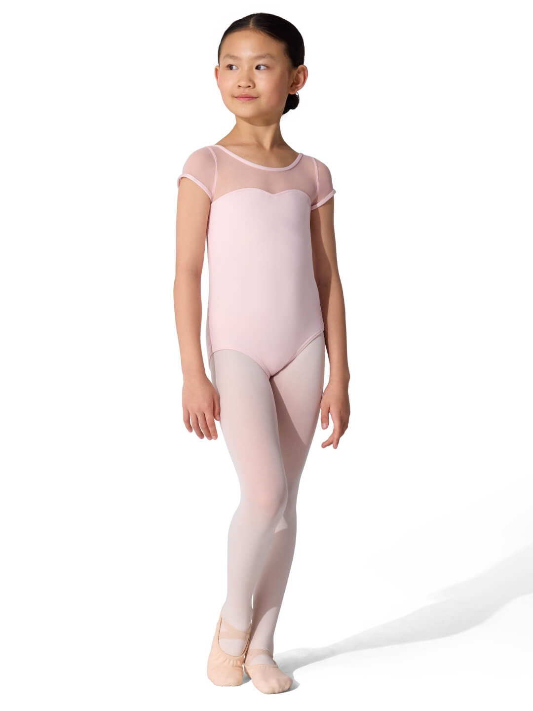Young girl in a pink ballet outfit on a white background