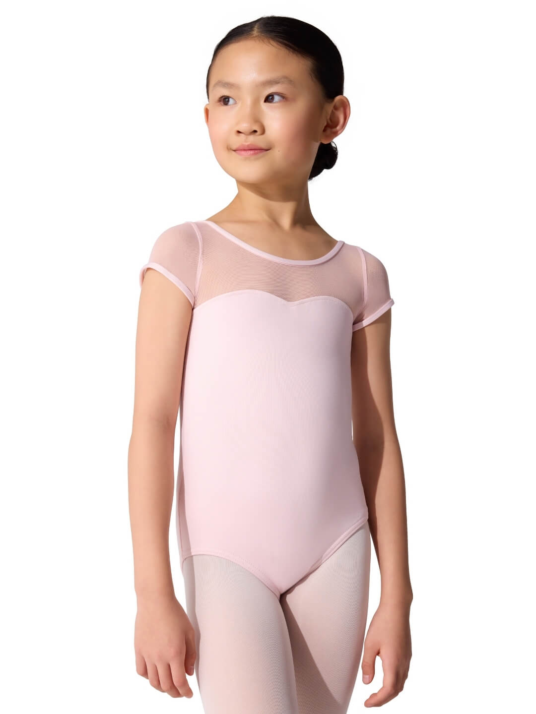 Young girl wearing a pink ballet leotard on a white background
