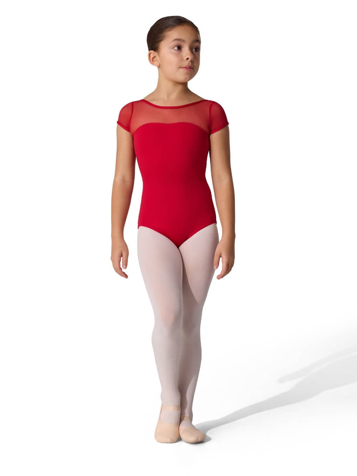Young girl in a red ballet leotard and beige tights on a white background