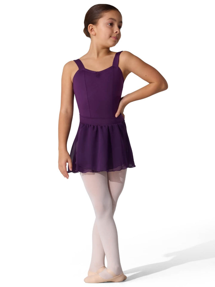 Young girl in a purple ballet dress on a white background