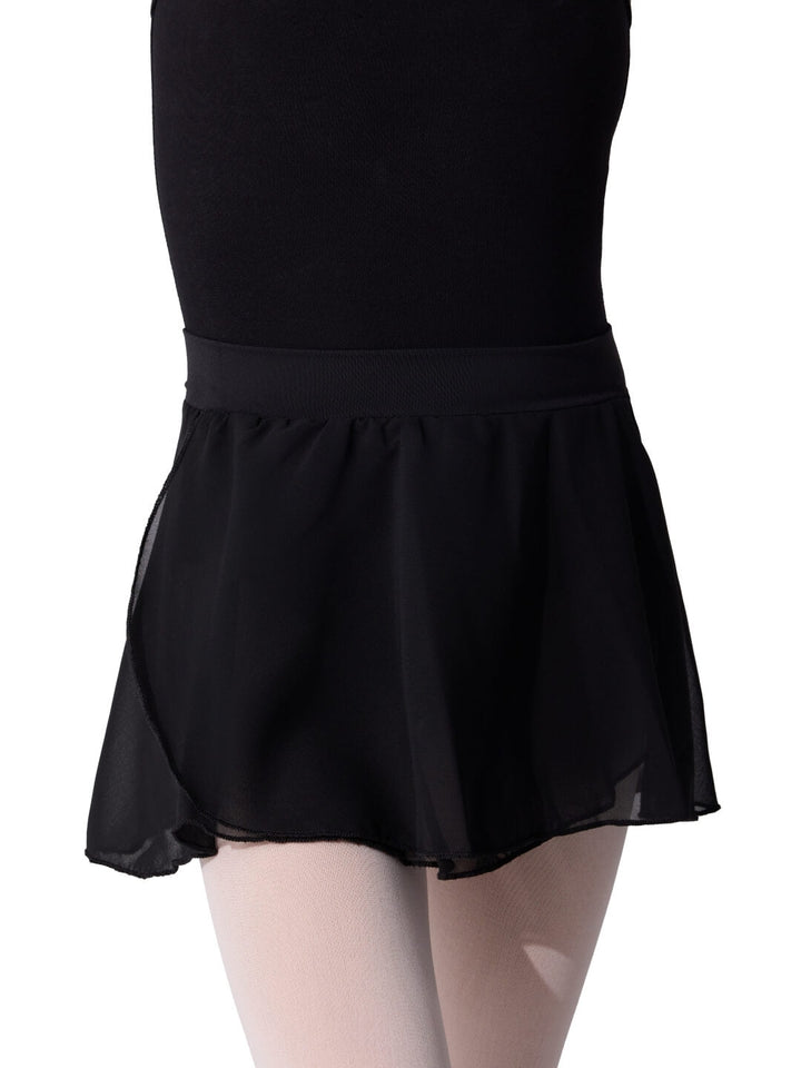 Black skirt worn over a black leotard on a white background