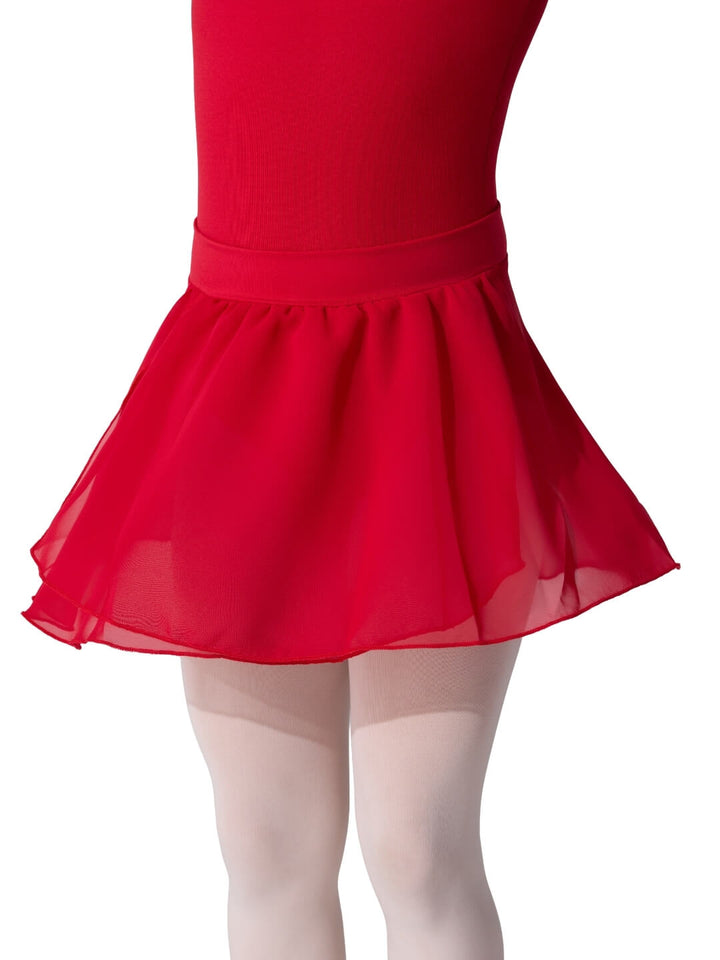 Red skirt worn with a white background