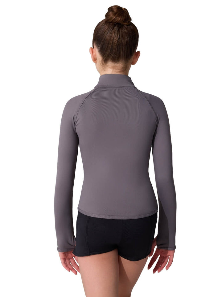 Person wearing a gray long-sleeve athletic top and black shorts on a white background