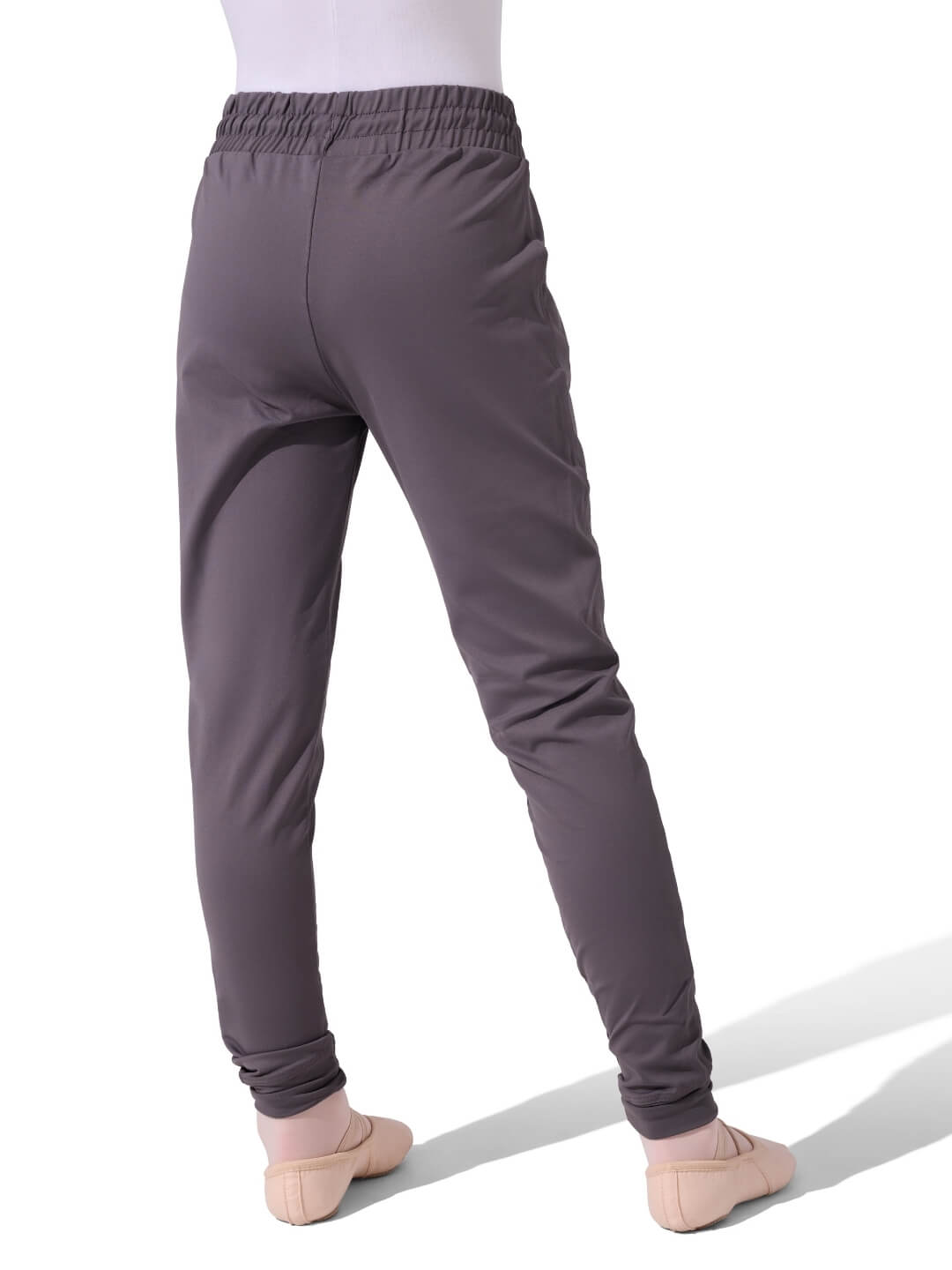 Gray jogger pants worn by a person on a white background