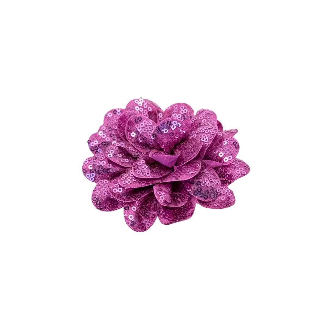 Purple sequin flower on a white background