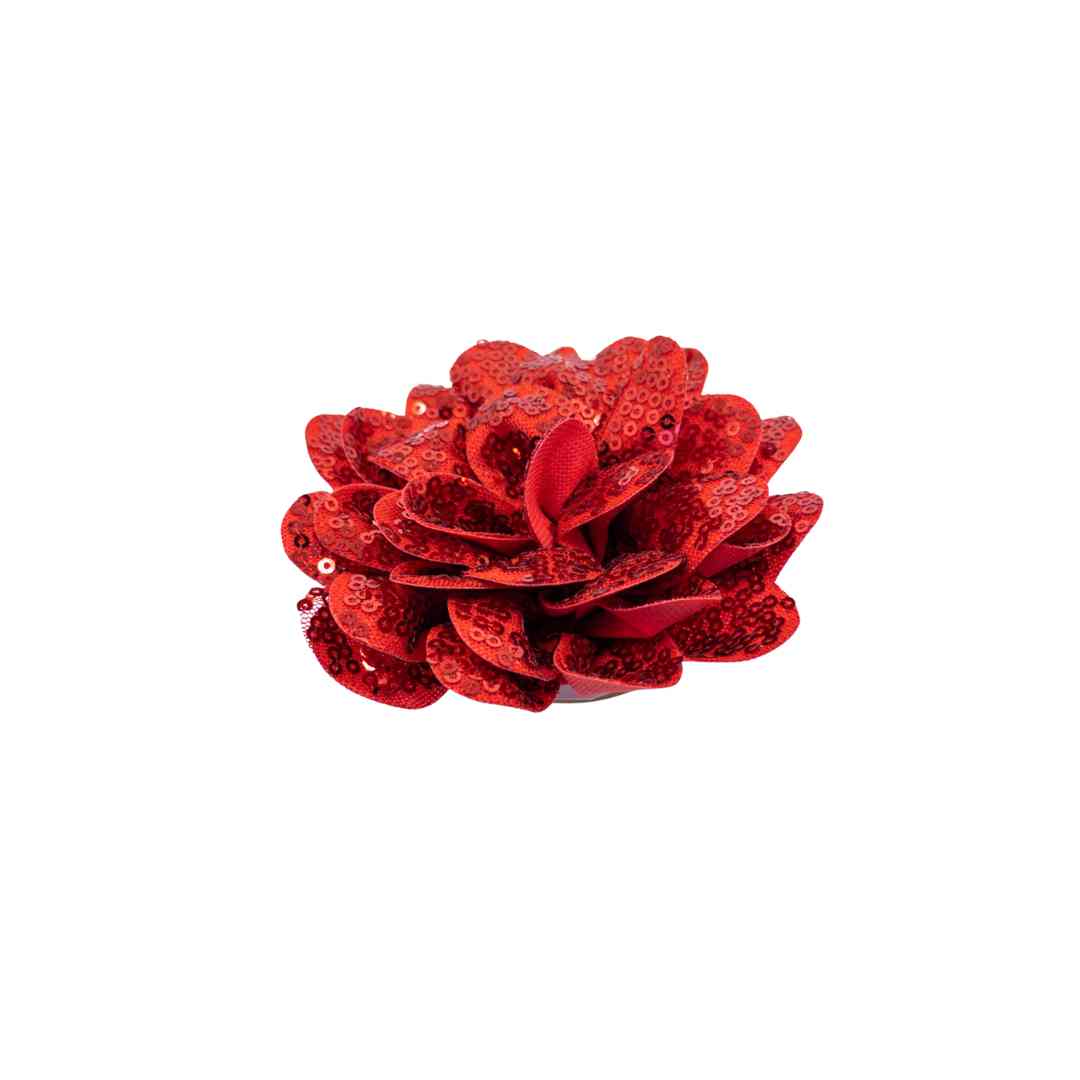 Red sequin flower accessory on a white background