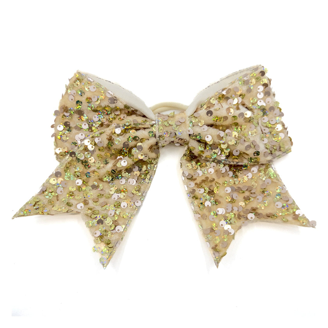 Beige sequin bow on a white background
