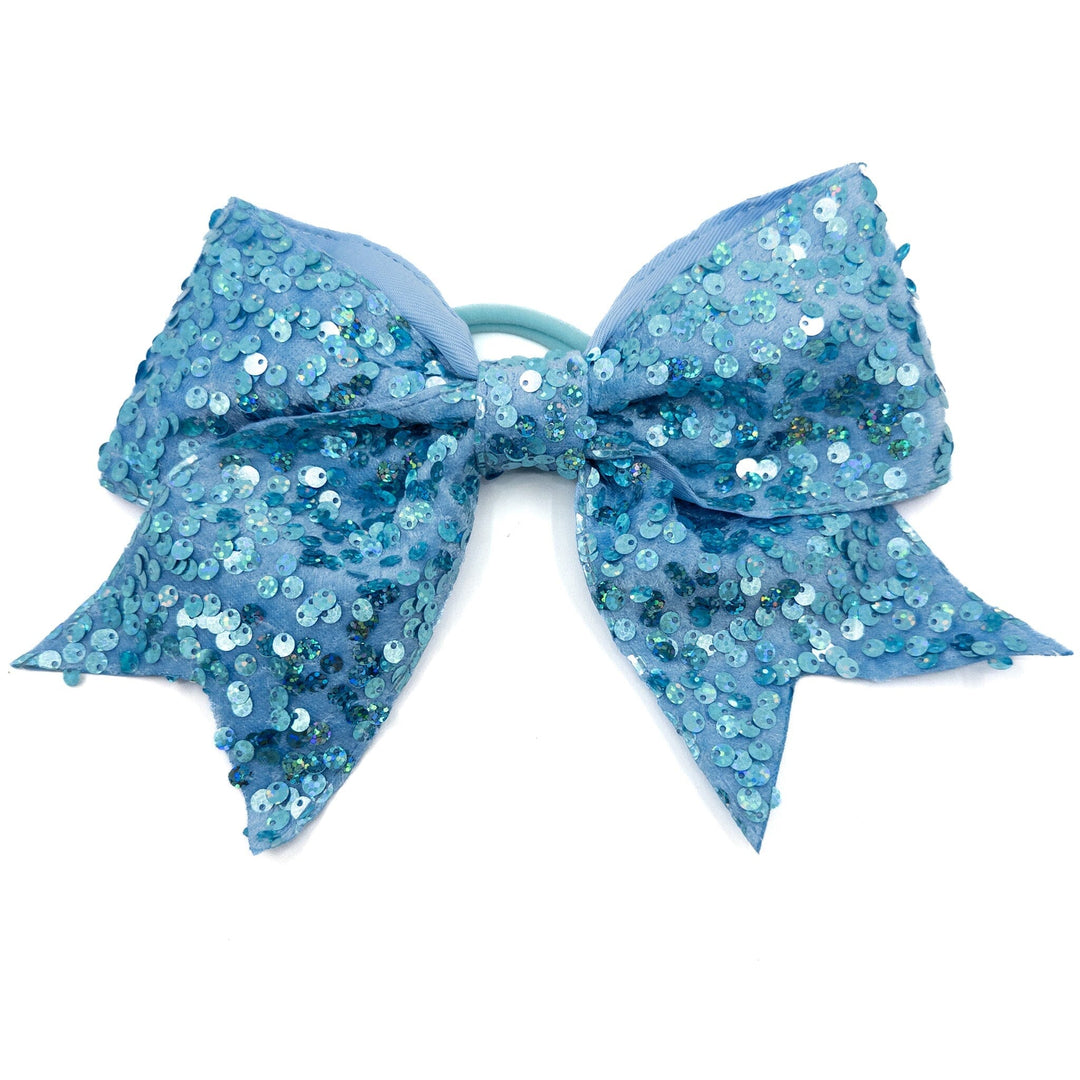 Blue glittery hair bow on a white background