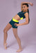 Dancer in a green and yellow leotard posing against a light purple background