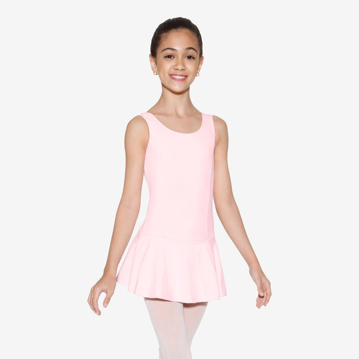 Young girl wearing a pink dress against a white background