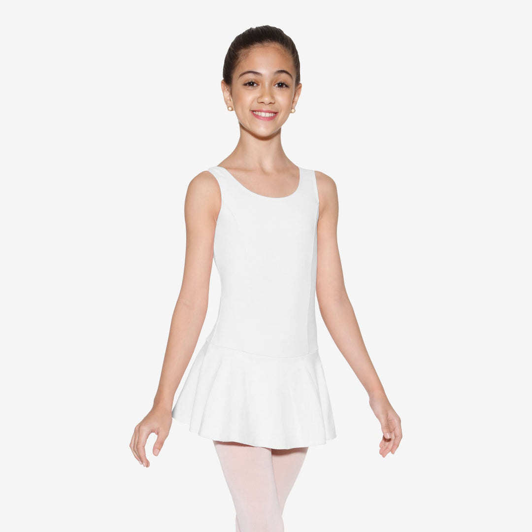Young girl wearing a white sleeveless dress on a plain background