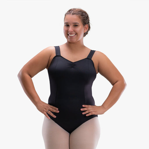 Woman wearing a black leotard on a white background
