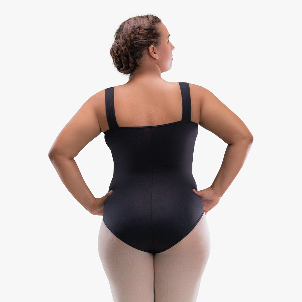Person wearing a black bodysuit on a white background