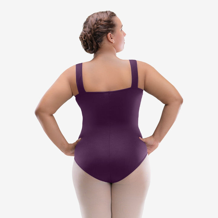 Person wearing a purple leotard on a white background