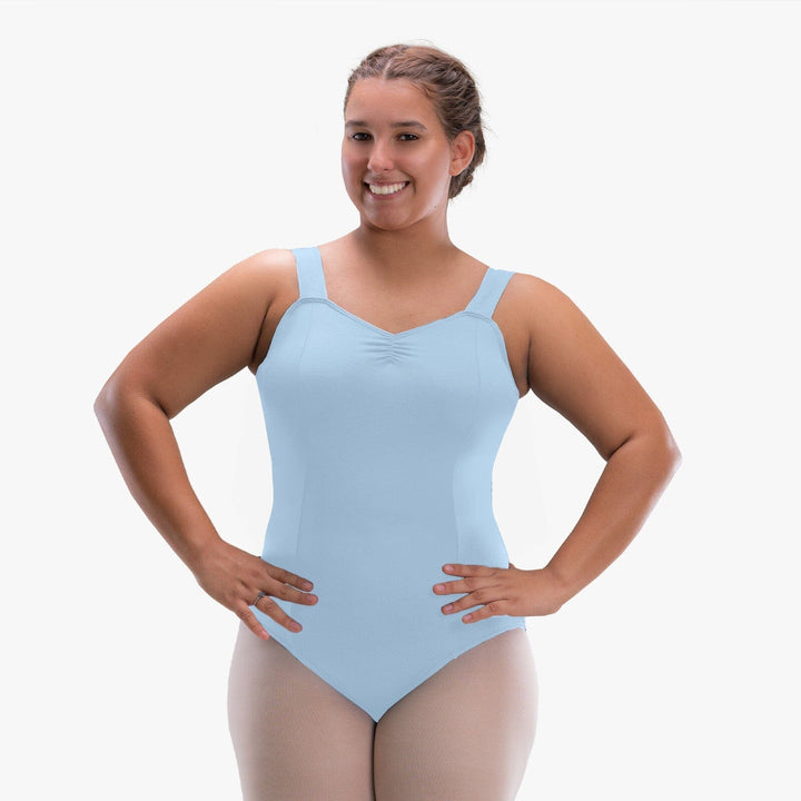 Woman wearing a light blue leotard on a white background