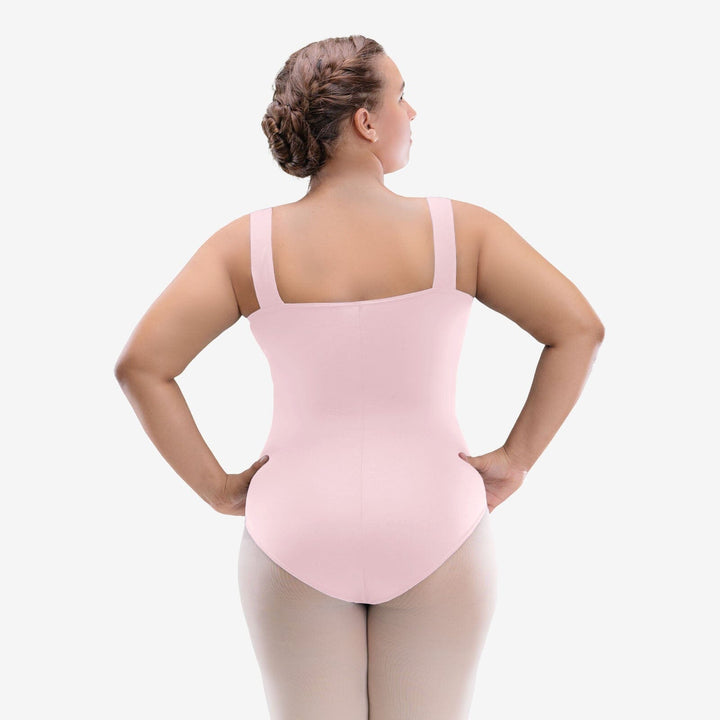 Person wearing a pink leotard on a white background