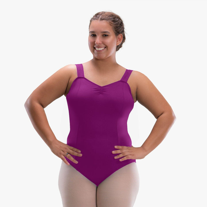 Woman wearing a purple leotard on a white background