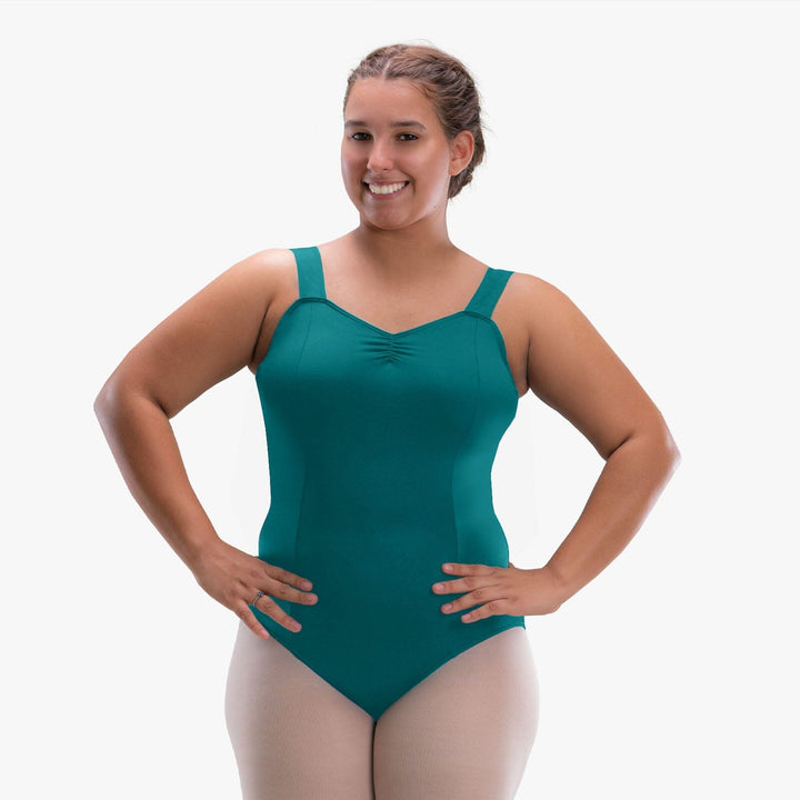 Woman wearing a teal swimsuit on a white background