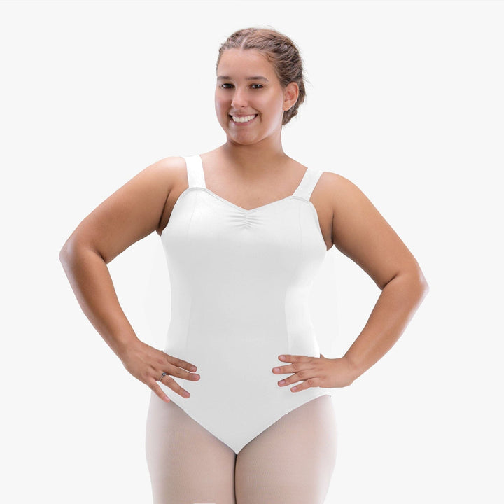 Woman wearing a white bodysuit against a white background
