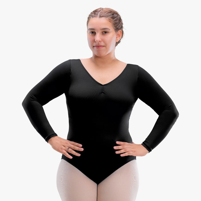 Woman wearing a black long-sleeve leotard on a white background
