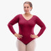 Woman wearing a maroon long-sleeve leotard on a white background