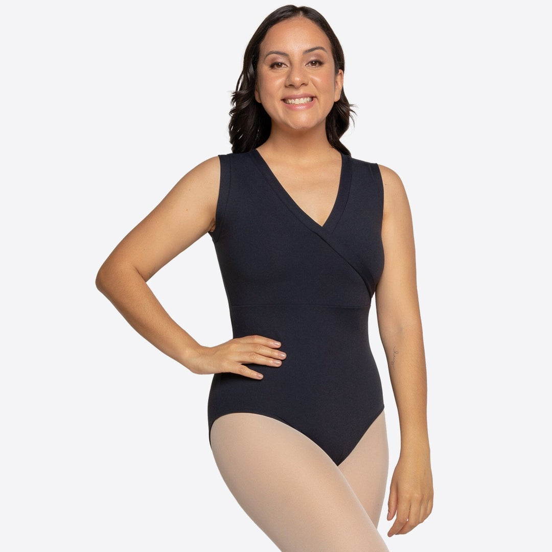 Woman wearing a black bodysuit on a white background