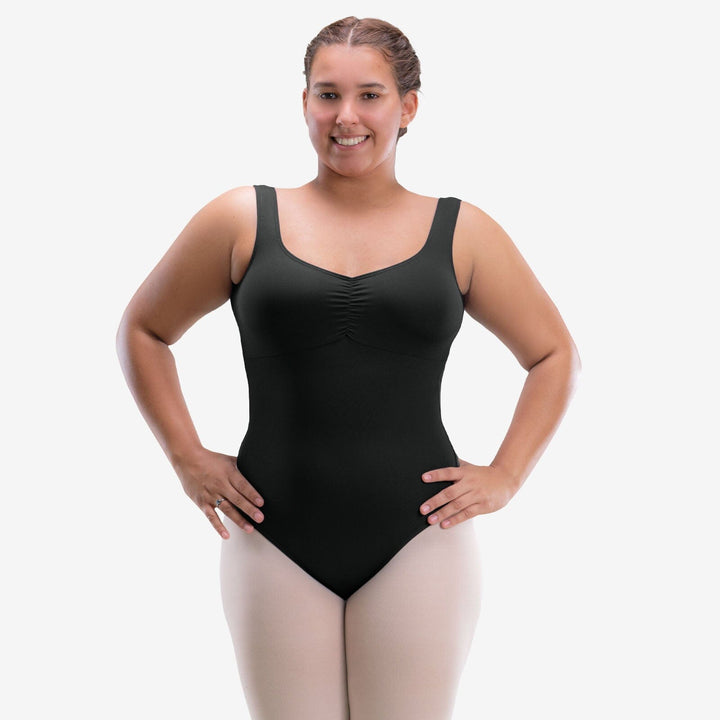 Woman wearing a black leotard on a white background