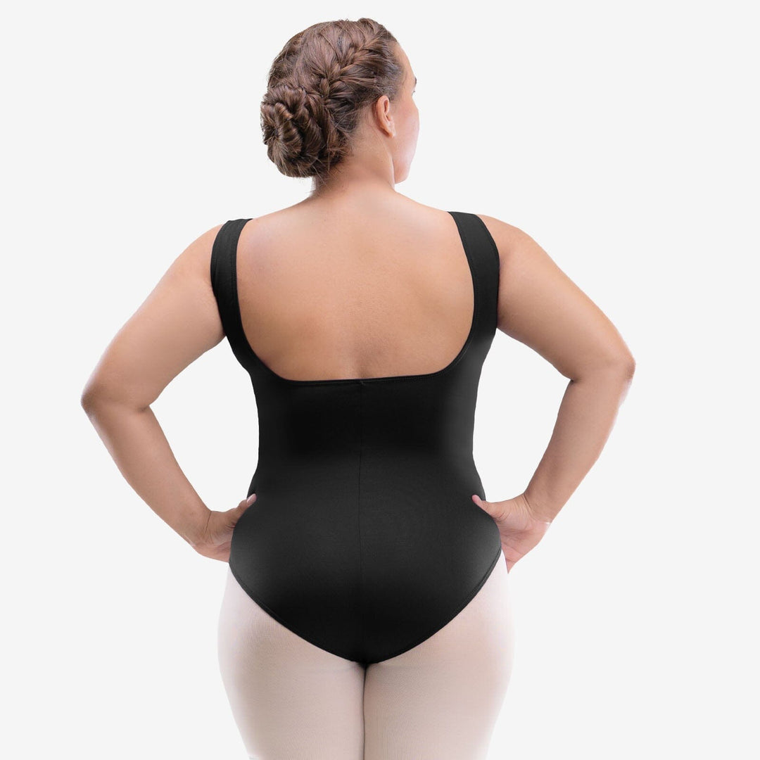 Person wearing a black bodysuit against a white background