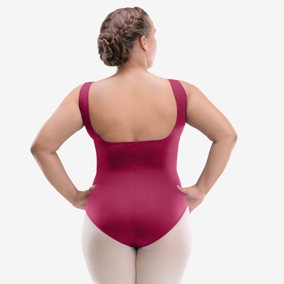 Person wearing a maroon bodysuit on a white background
