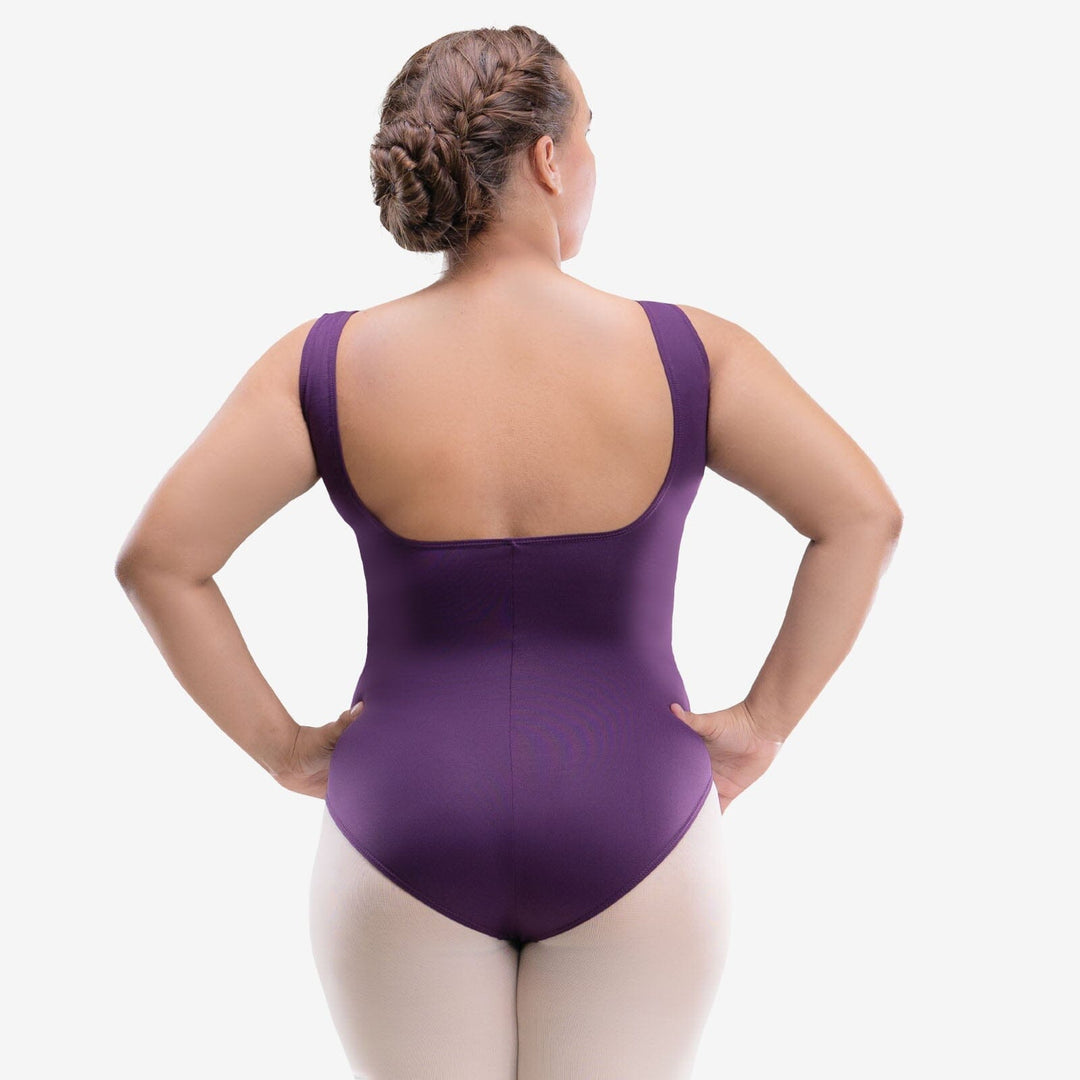 Person wearing a purple leotard on a white background