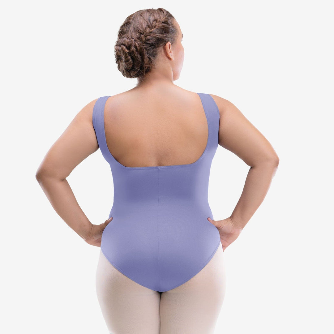 Person wearing a purple leotard on a white background