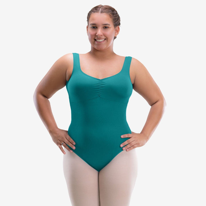 Woman wearing a teal swimsuit on a white background