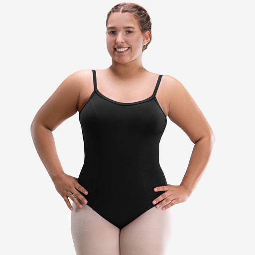 Woman wearing a black leotard on a plain background