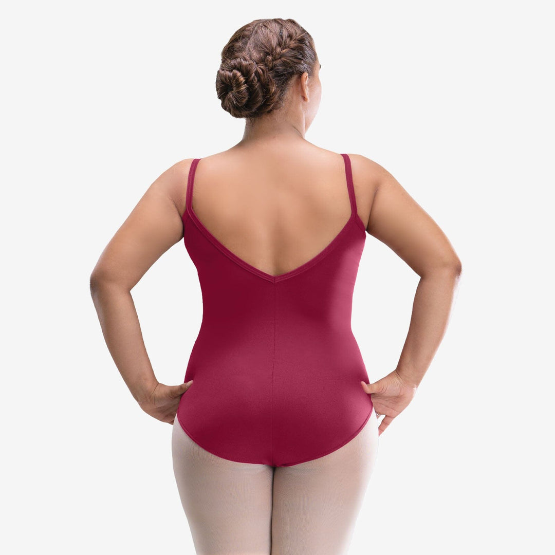 Woman wearing a red leotard on a white background
