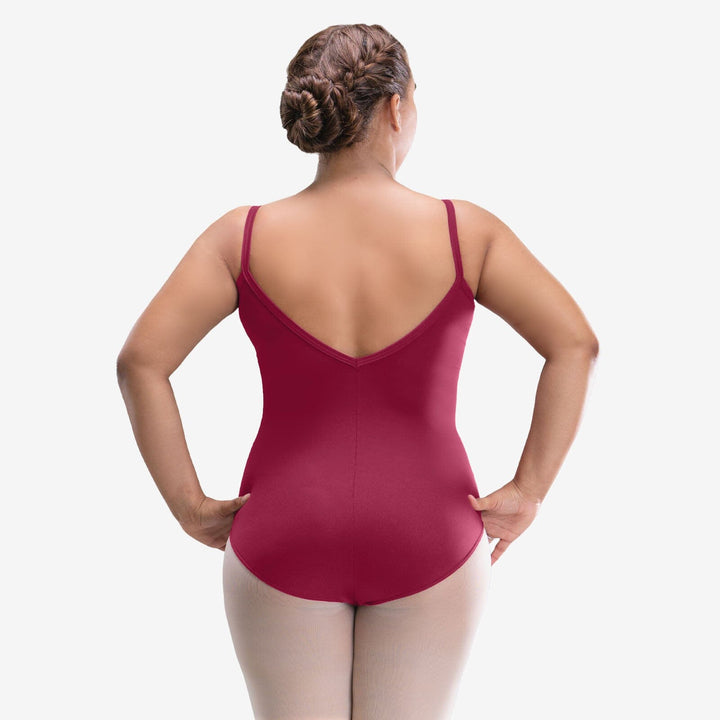 Woman wearing a red leotard on a white background