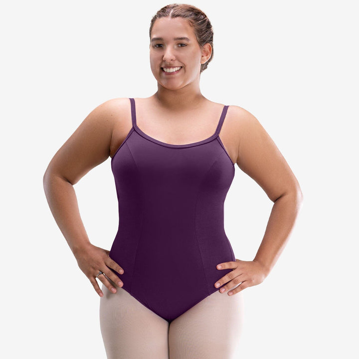 Woman wearing a purple leotard on a white background