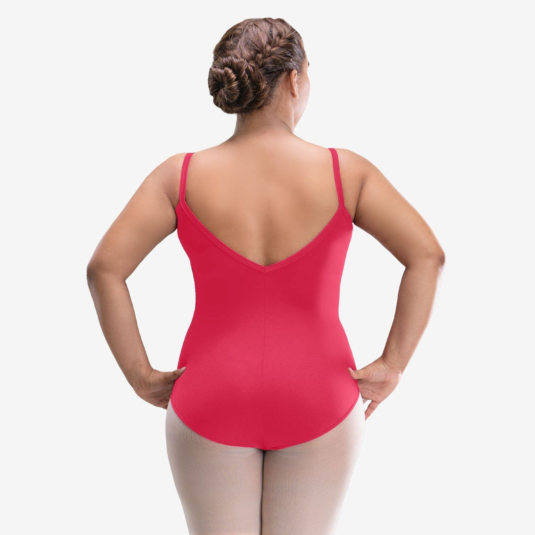 Person wearing a red leotard on a white background