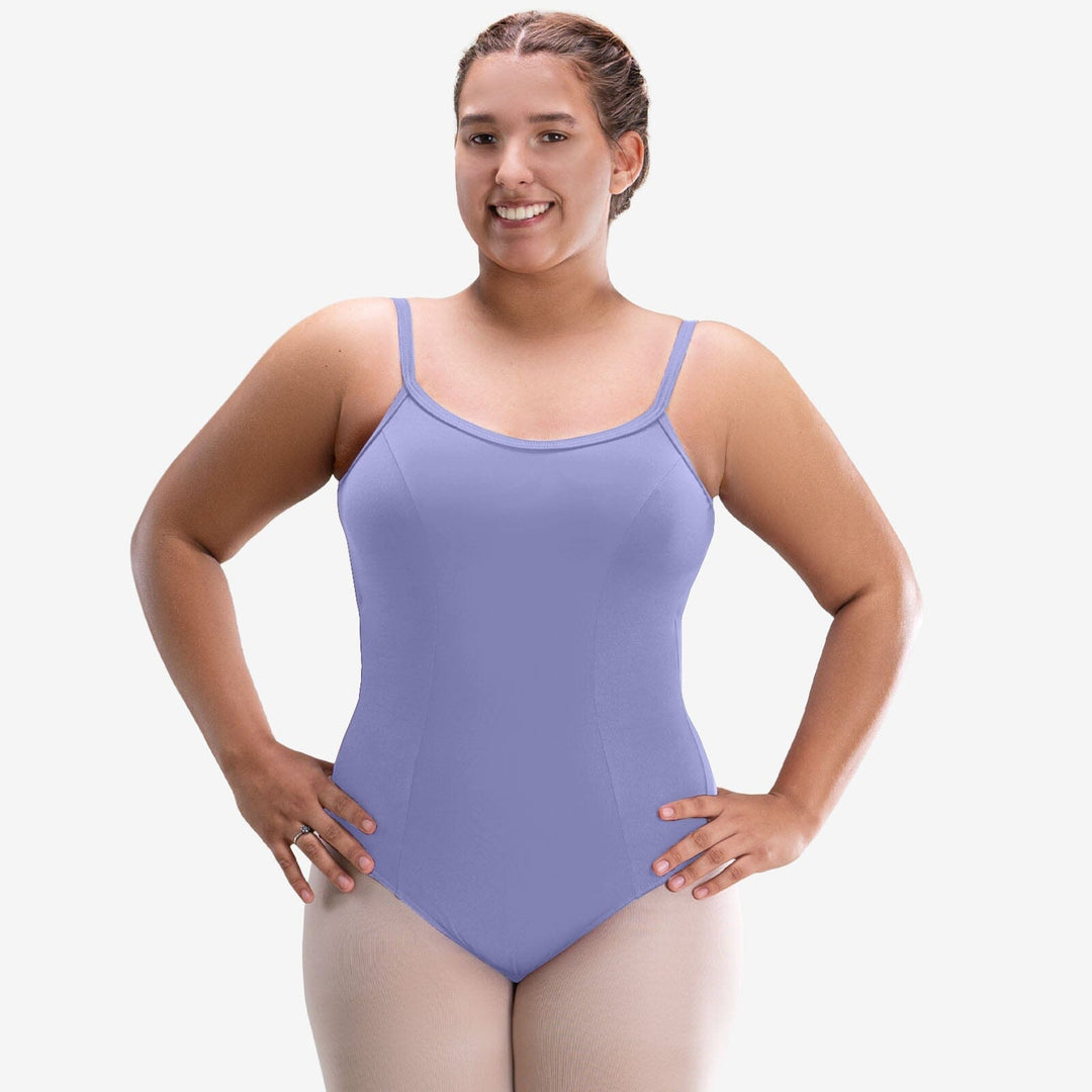 Woman wearing a purple leotard on a white background