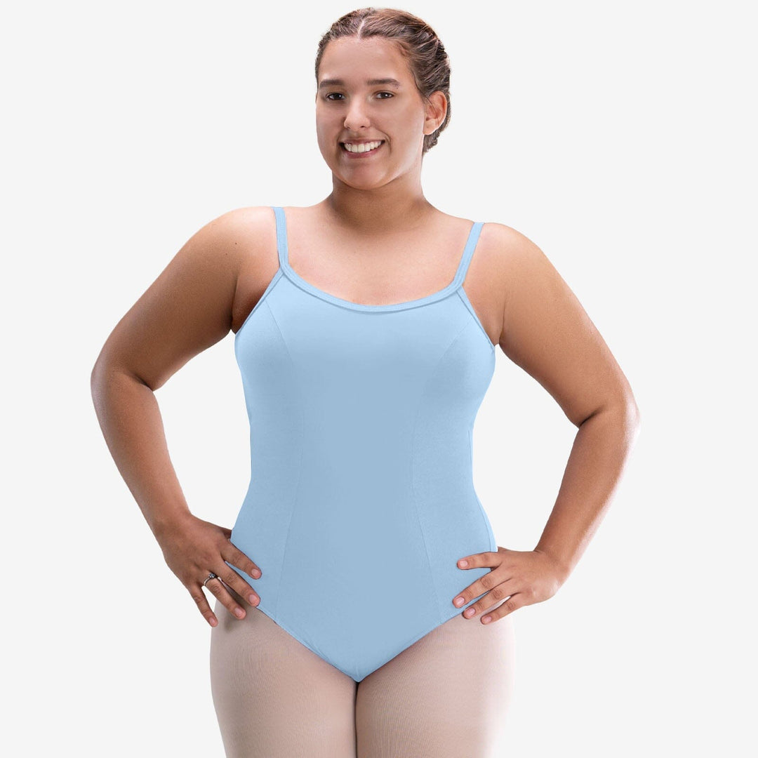 Woman wearing a light blue leotard on a white background