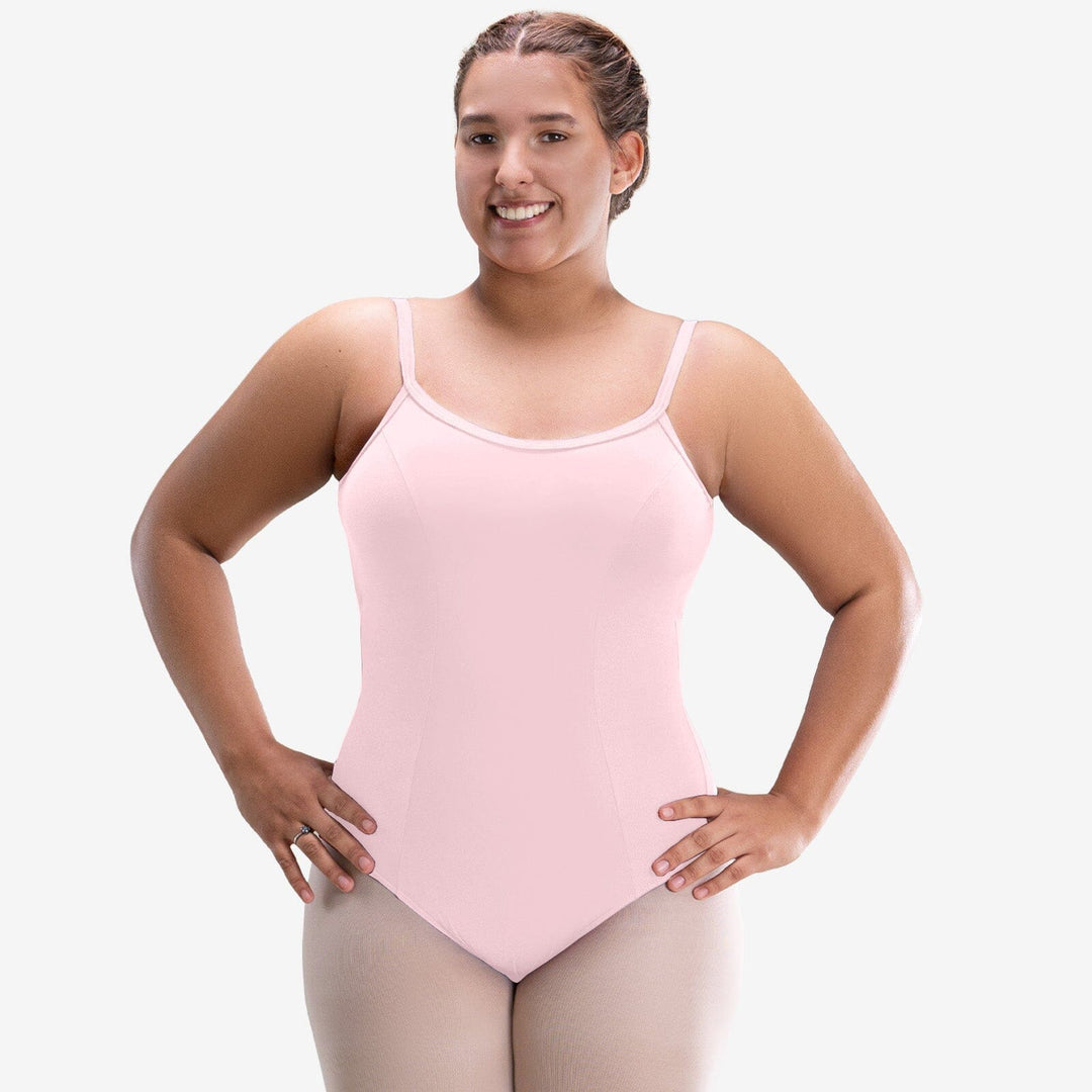 Woman wearing a pink leotard on a white background