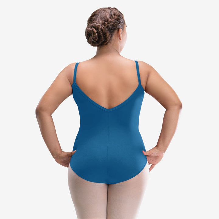 Woman wearing a blue leotard on a white background