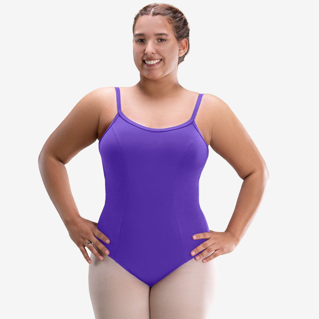 Woman wearing a purple swimsuit on a white background