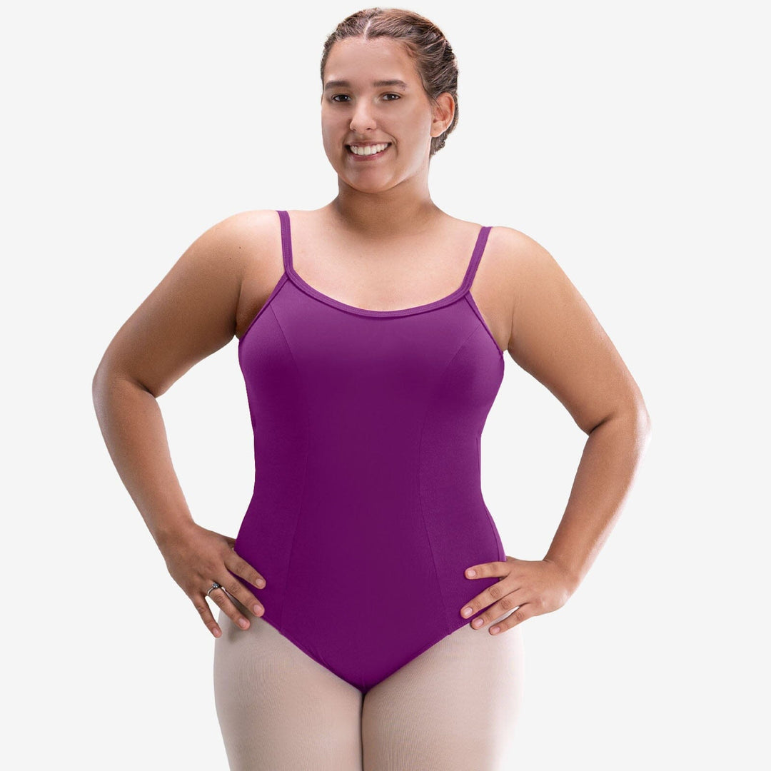 Woman wearing a purple leotard on a white background