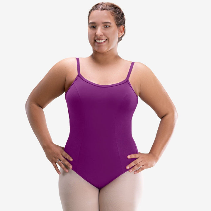 Woman wearing a purple leotard on a white background