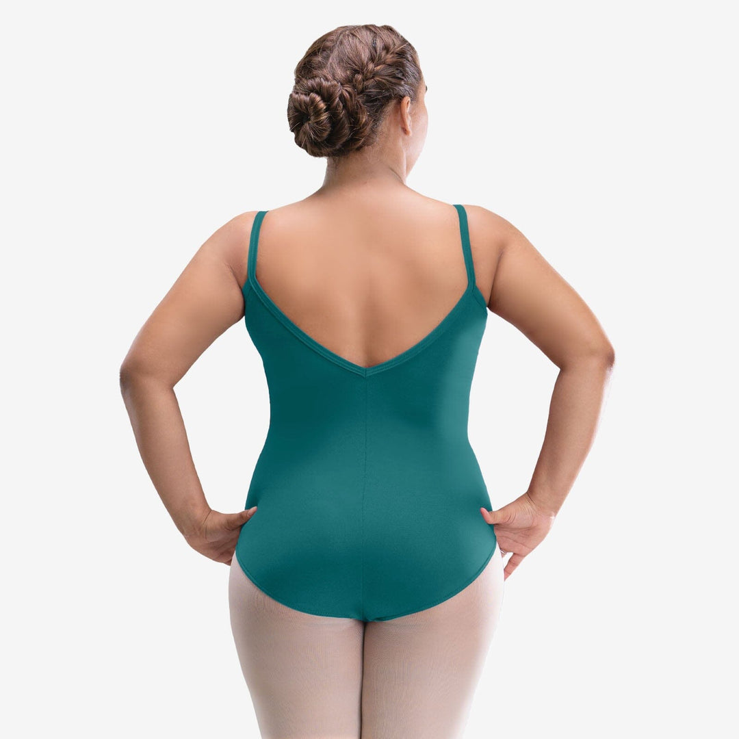 Person wearing a teal leotard on a white background