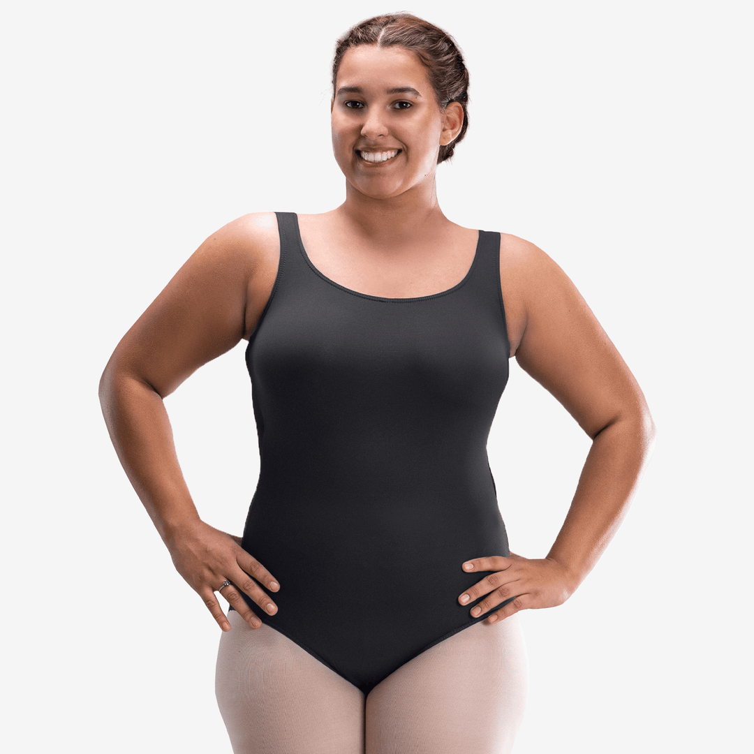 Woman wearing a black bodysuit on a white background