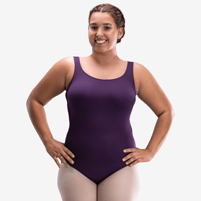 Woman wearing a purple leotard on a white background