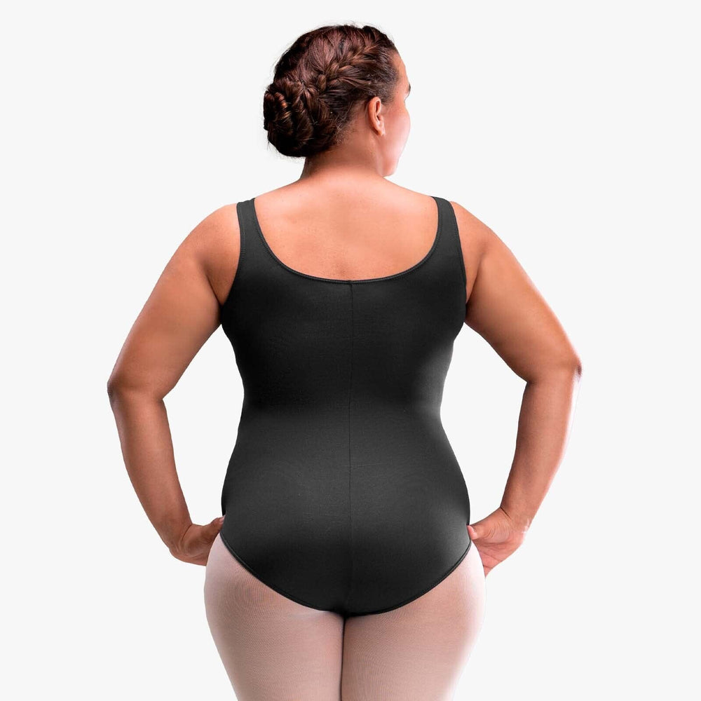 Person wearing a black bodysuit against a white background