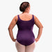 Person wearing a purple leotard on a white background